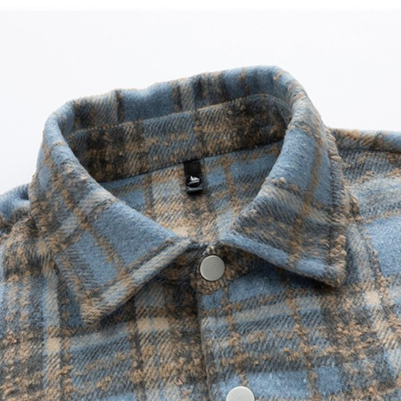 Unisex classic plaid button-up jacket on a hanger, showcasing its timeless vintage fall/winter outerwear style.