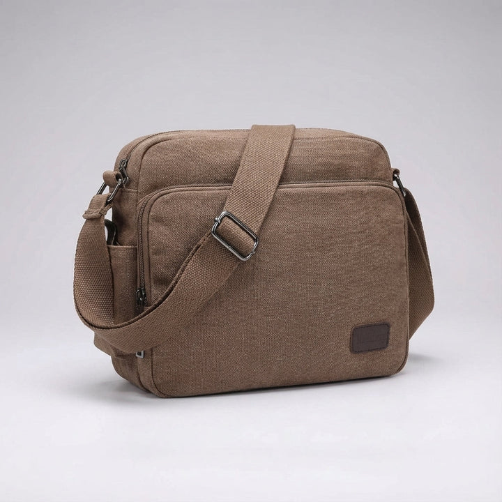 Versatile compact unisex crossbody bag, great for everyday essentials. Durable canvas and lightweight design.