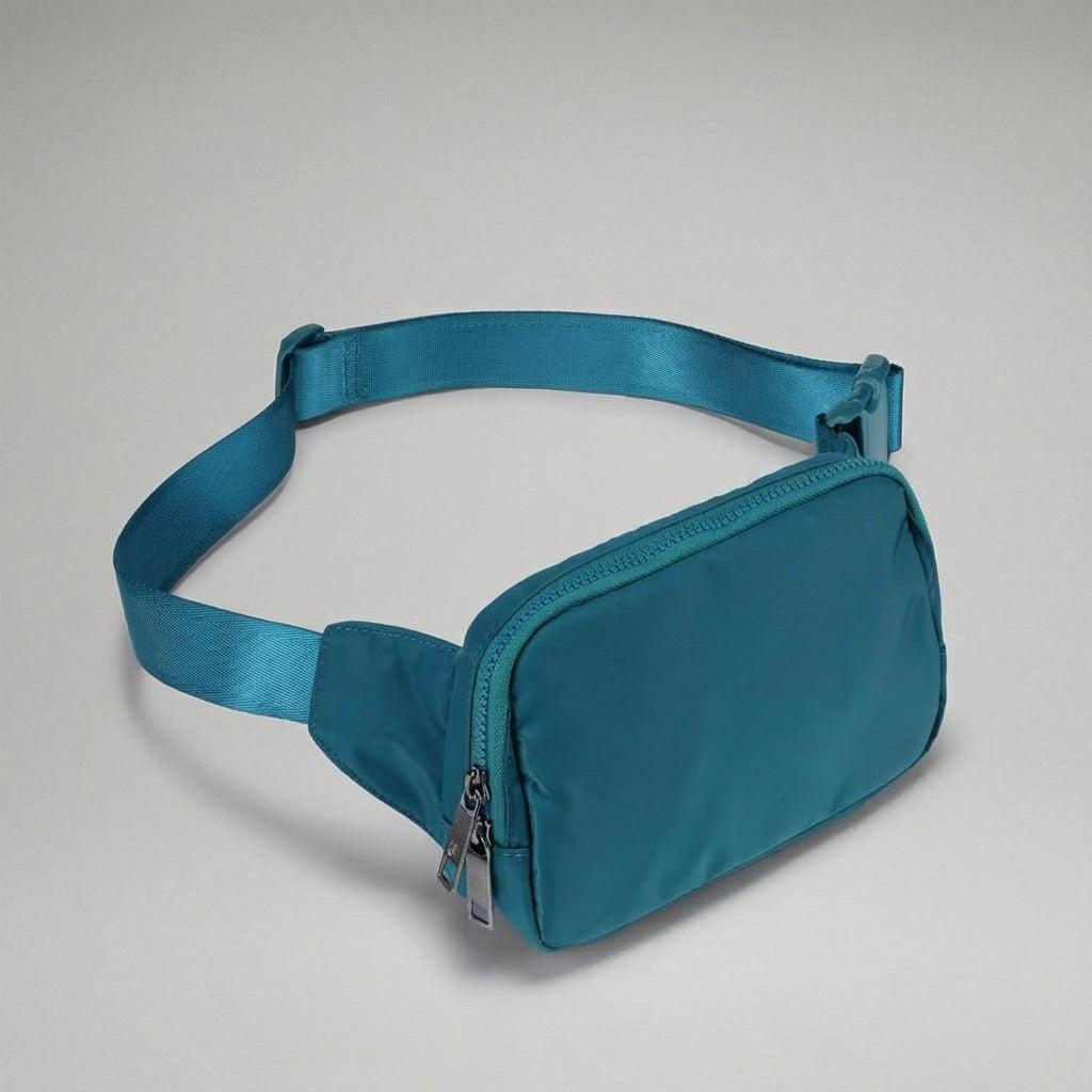Compact nylon fanny pack, versatile for men & women. Great crossbody bag for everyday essentials.