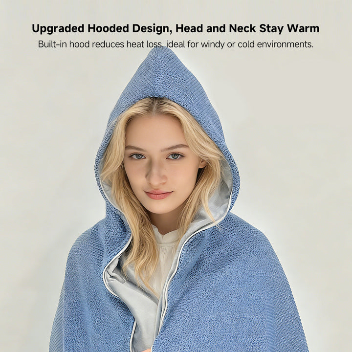 Woman wearing a portable cordless graphene heated shawl while working at an office desk