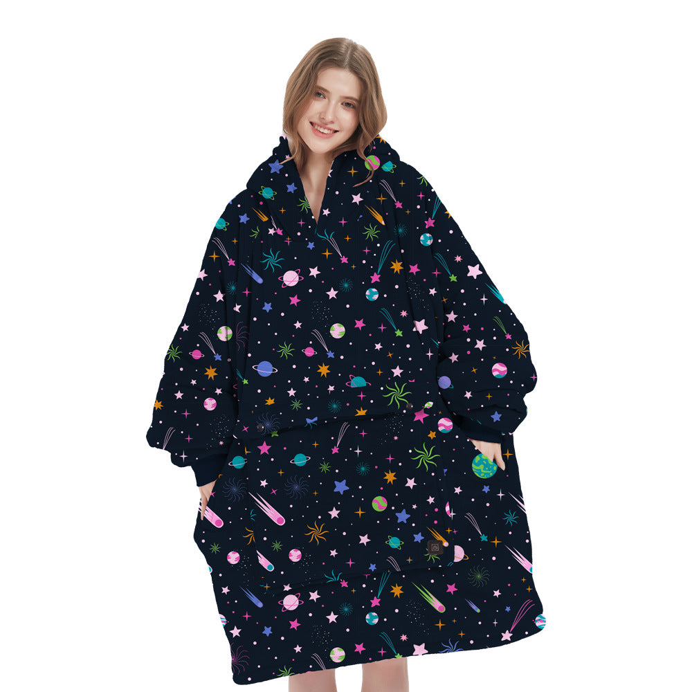 Happy person smiling while wearing a cozy unisex heated flannel hoodie blanket, embracing winter comfort and warmth.