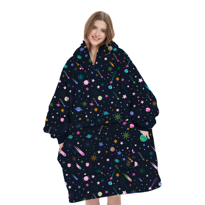 Happy person smiling while wearing a cozy unisex heated flannel hoodie blanket, embracing winter comfort and warmth.