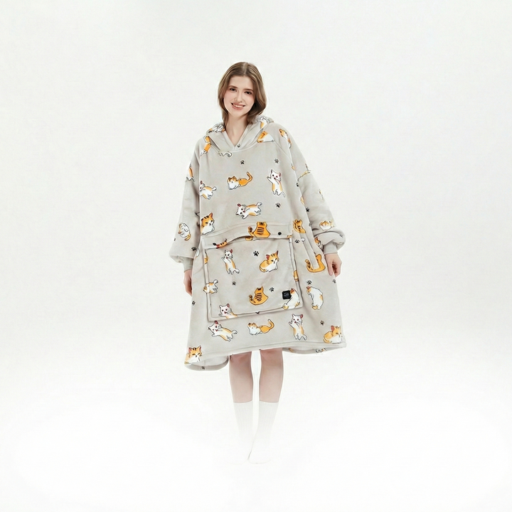 Unisex cordless heated flannel hoodie blanket draped over a chair, inviting coziness and warmth for any winter moment.