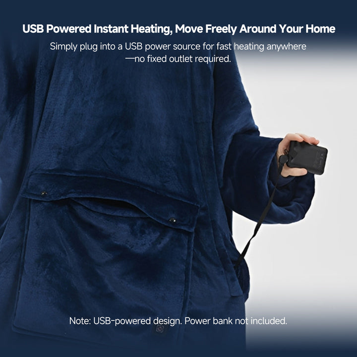 Model wearing a cozy unisex cordless heated flannel hoodie blanket, ideal for indoor or outdoor winter use.