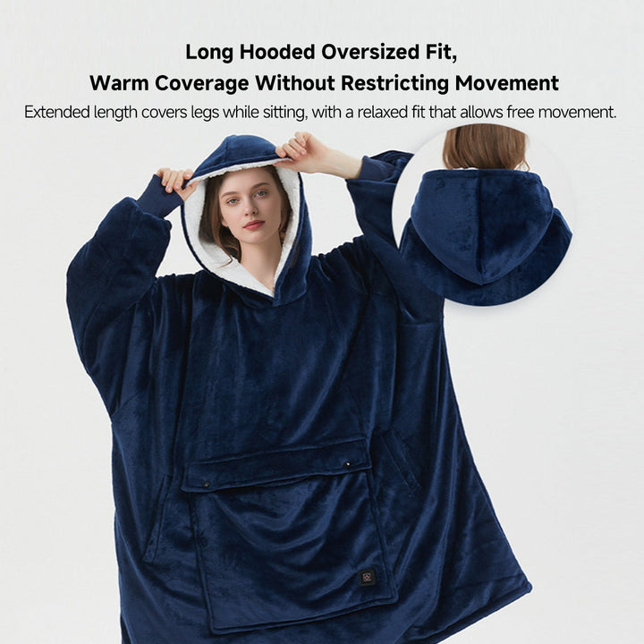 Woman enjoying a book while snuggled in a cozy, oversized flannel heated hoodie blanket for winter comfort.