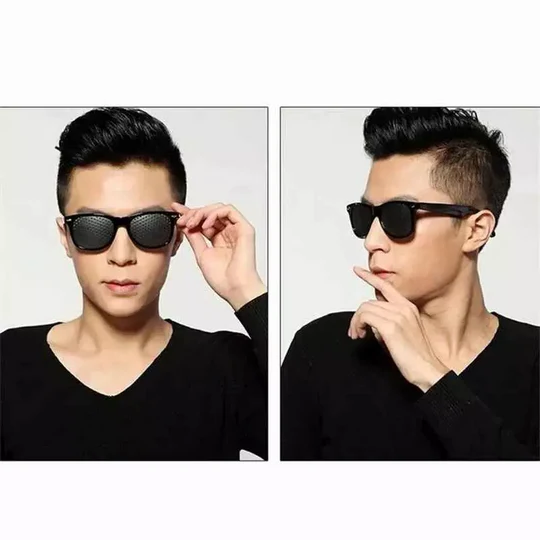 Person wearing unisex pinhole glasses for vision improvement, perfect for daily eye care and strain relief.