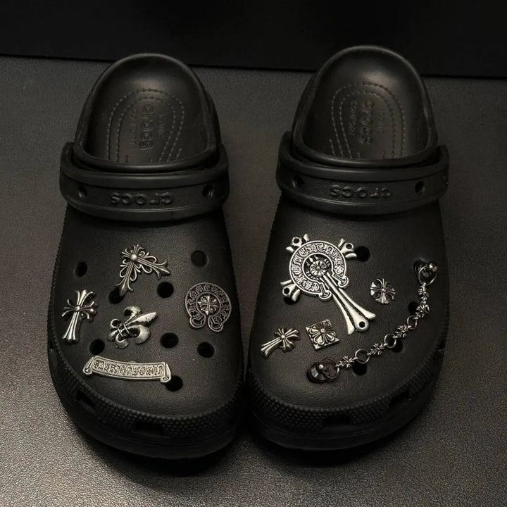 Collection of unisex metal shoe charms for Crocs, including chrome and Lost Saturn designs.