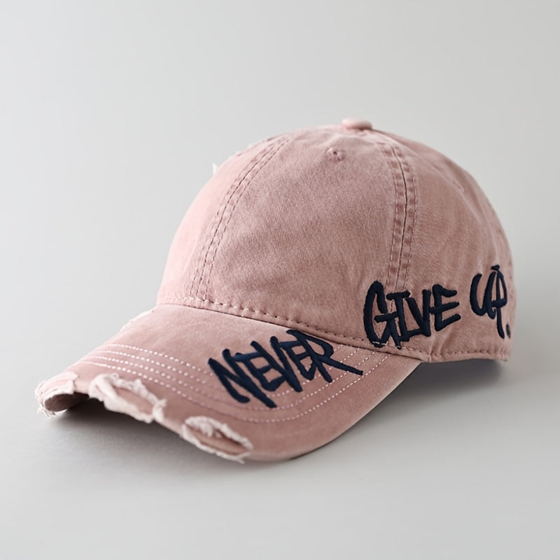 "Never Give Up" distressed denim cap. Unisex, frayed, adjustable baseball hat for a motivational street style look.