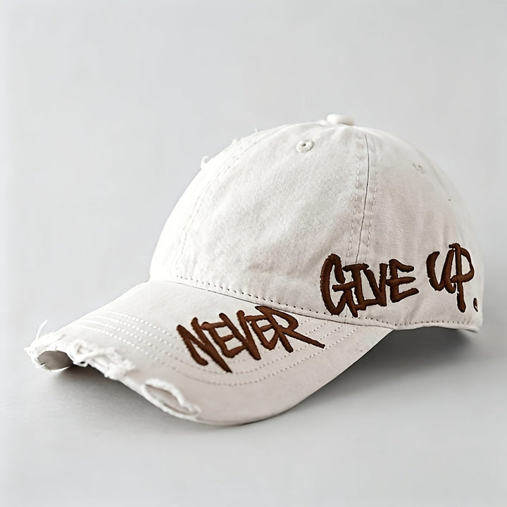 Stylish unisex distressed denim baseball cap. Features "Never Give Up" embroidery & a washed finish.