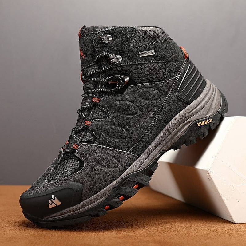 Unisex black and blue durable trekking sneakers, worn by hiker in outdoor setting, adventure gear
