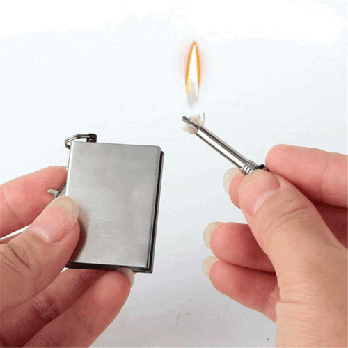 Igniting a fire with a flint match lighter, a powerful outdoor adventure survival tool
