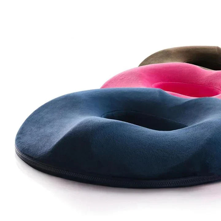Unisex ergonomic donut seat cushion for tailbone pain relief, memory foam, pressure support & comfort.