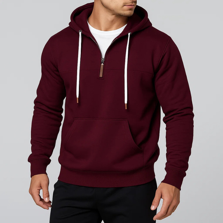 Modern unisex pullover hoodie with a half-zip design, offering casual everyday style & warmth.