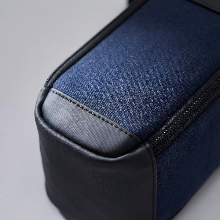 Unisex model wearing a black CarryGuard messenger bag, perfect crossbody for daily commute & travel.