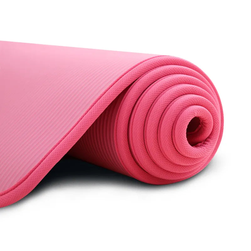 Black anti-slip extra thick yoga mat rolled up, ready for fitness, exercise, and comfortable home gym workouts.