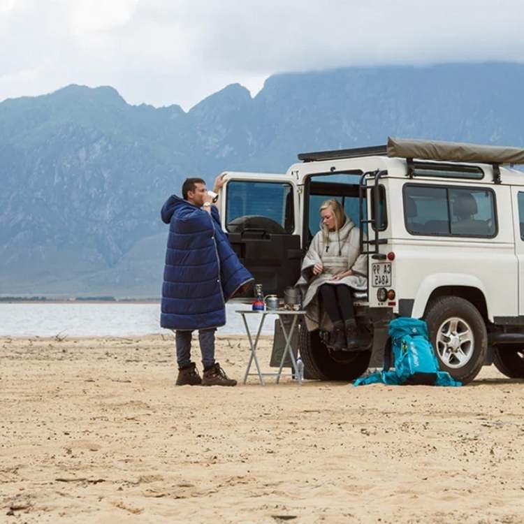 Close-up of the soft fleece lining inside a durable, waterproof outdoor poncho, ideal for travelers