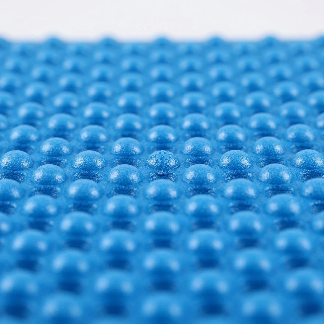 Hiker resting on a foldable camping mat. Ultralight XPE foam sleeping pad for comfortable outdoor adventures.