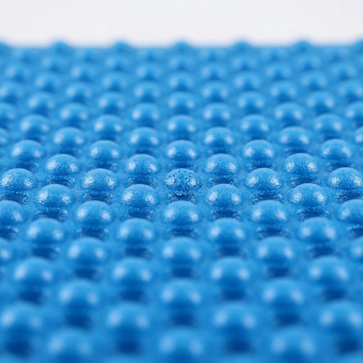 Hiker resting on a foldable camping mat. Ultralight XPE foam sleeping pad for comfortable outdoor adventures.