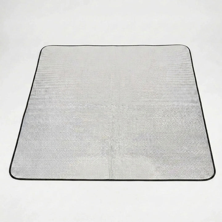 Reflective sleeping pad for camping, hiking, or picnics. Foldable design offers insulation & comfort.
