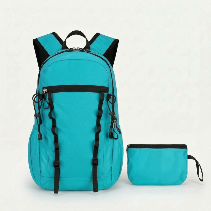 Durable nylon cyan foldable daypack, water-repellent for hiking, camping, & travel.