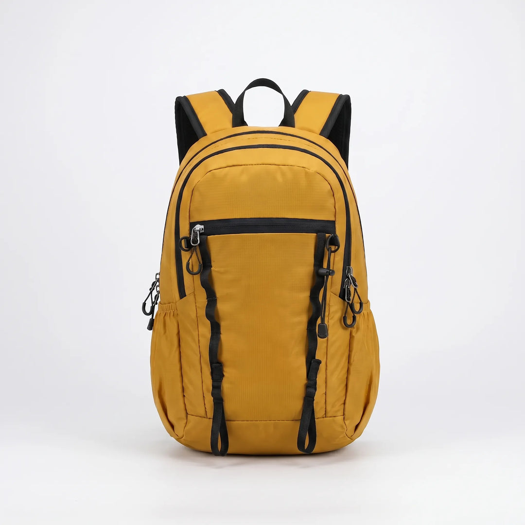 Packable cyan hiking daypack, lightweight nylon for easy storage & travel adventures.