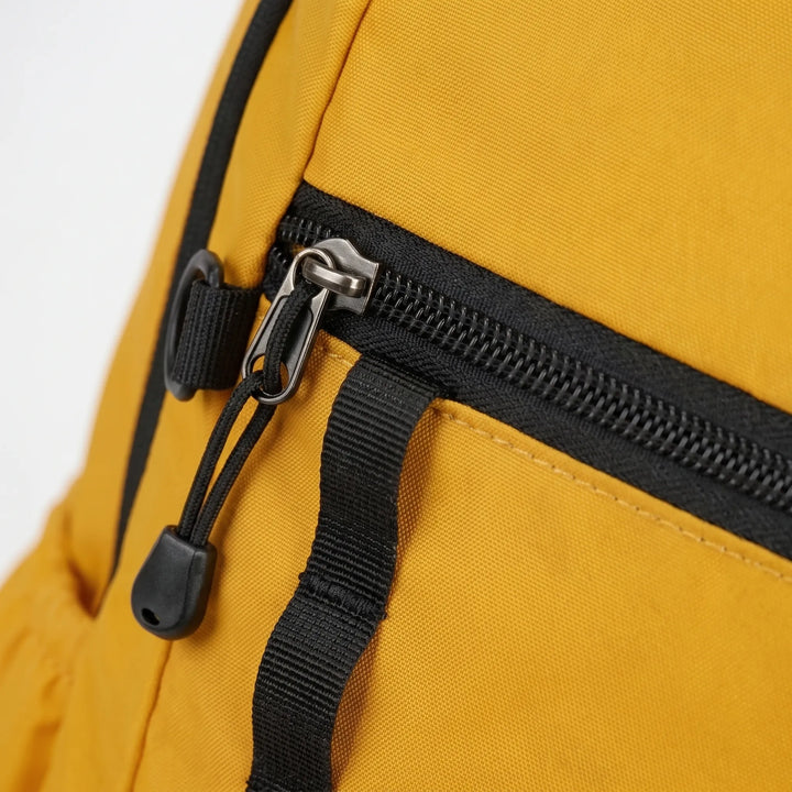 Cyan nylon water-repellent foldable daypack, perfect for lightweight hiking & travel.