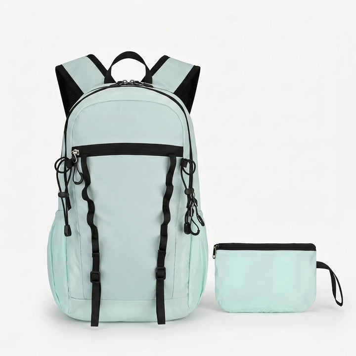 Unisex lightweight cyan hiking backpack, packable & water-repellent for outdoor travel.
