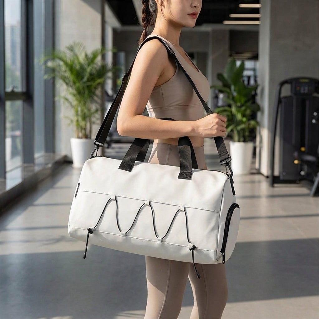 Unisex GearGlide travel duffel bag with separate shoe compartment & waterproof material. Ideal weekend carry-on & gym bag.
