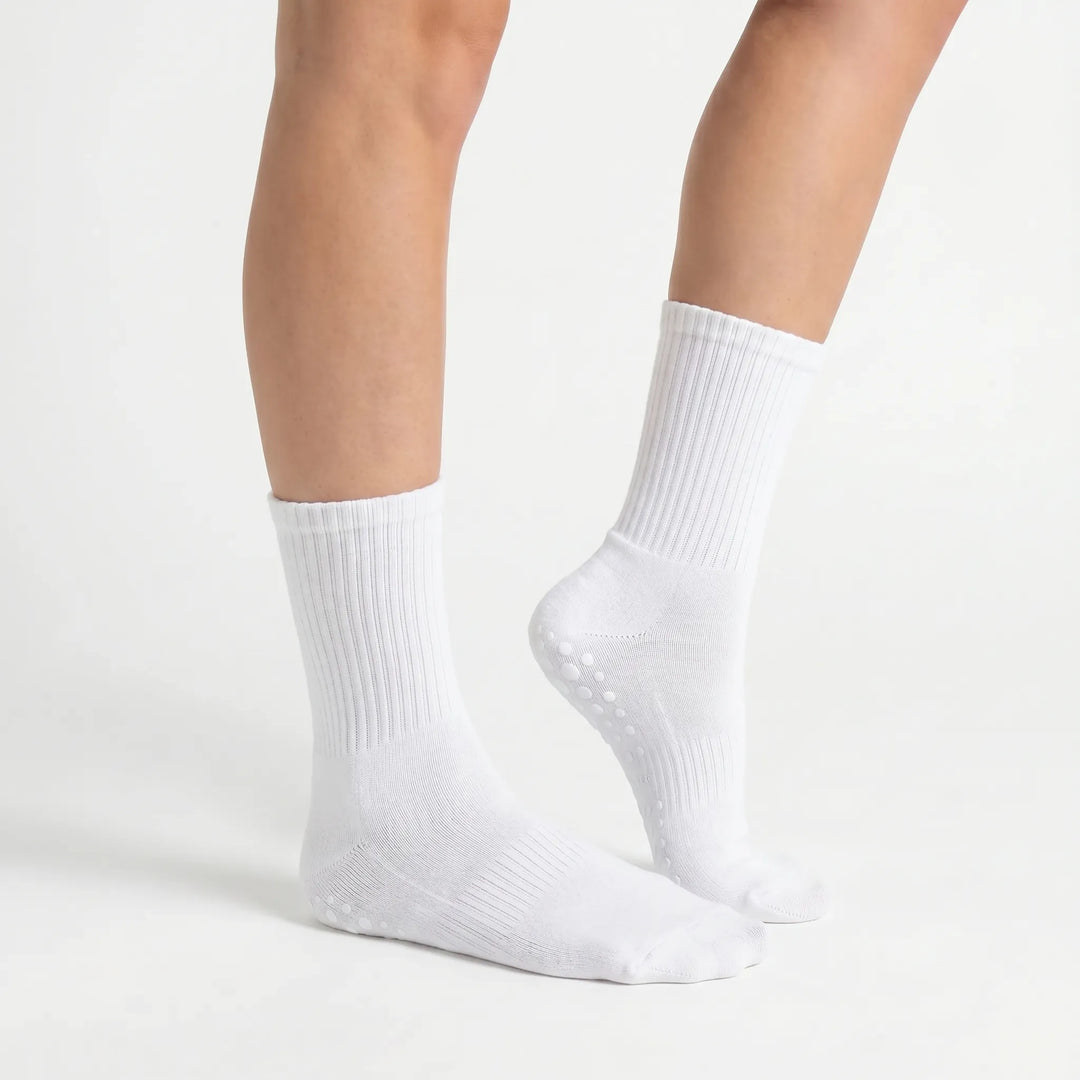 Secure non-slip grippy crew socks, enhancing balance and stability for Pilates, yoga, and studio classes.