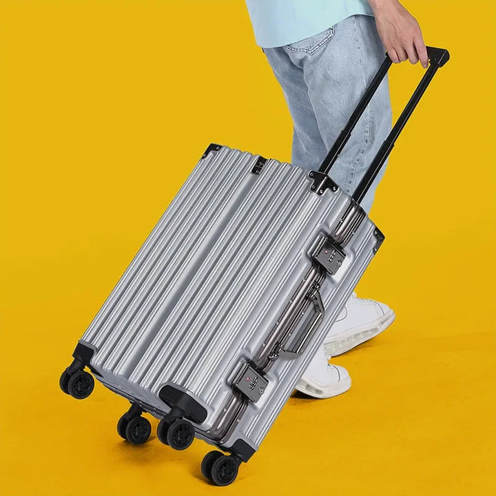 Stylish side profile of a unisex hard shell travel suitcase, emphasizing its sleek design & durability.