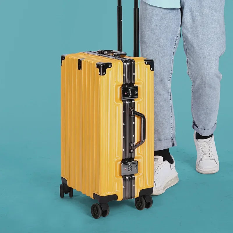 Robust aluminum frame detail on a sleek, modern unisex hard shell travel suitcase.