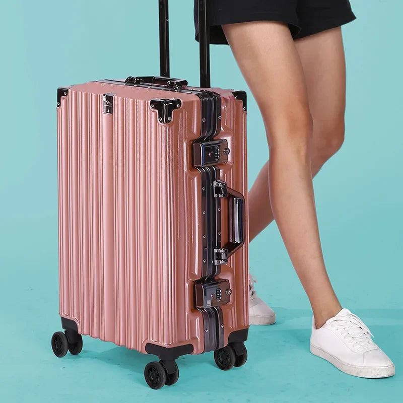 Large checked hard shell luggage, durable aluminum frame & secure lock, ready for long travel.