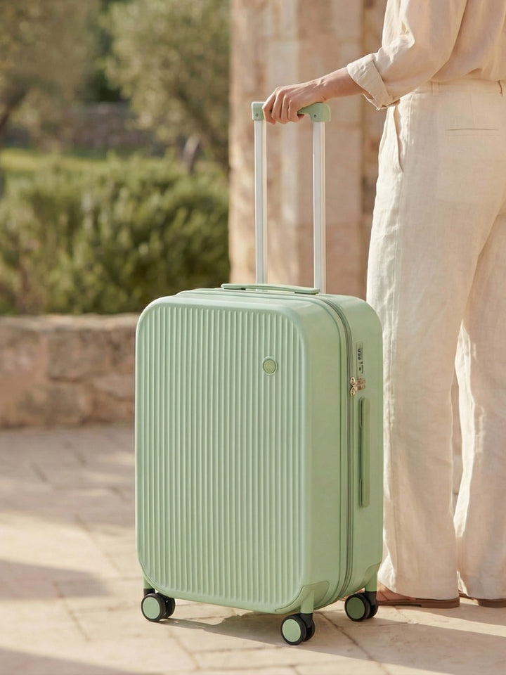 Durable hard-shell luggage featuring convenient cup & phone holders, smooth spinner wheels for easy navigation.