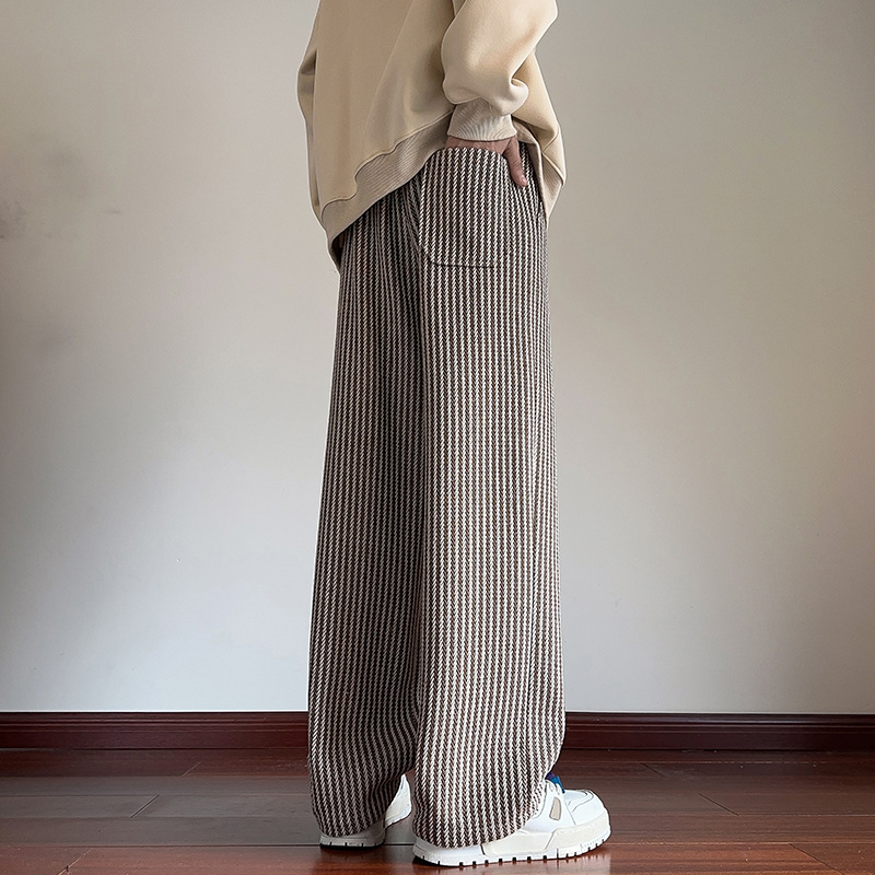 Versatile unisex herringbone style joggers, relaxed fit with a drawstring waist & side pockets.
