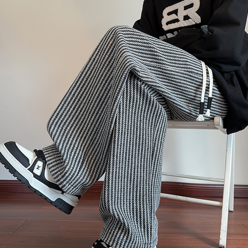 Relaxed fit unisex herringbone sweatpants, wide leg design for comfort & casual style.