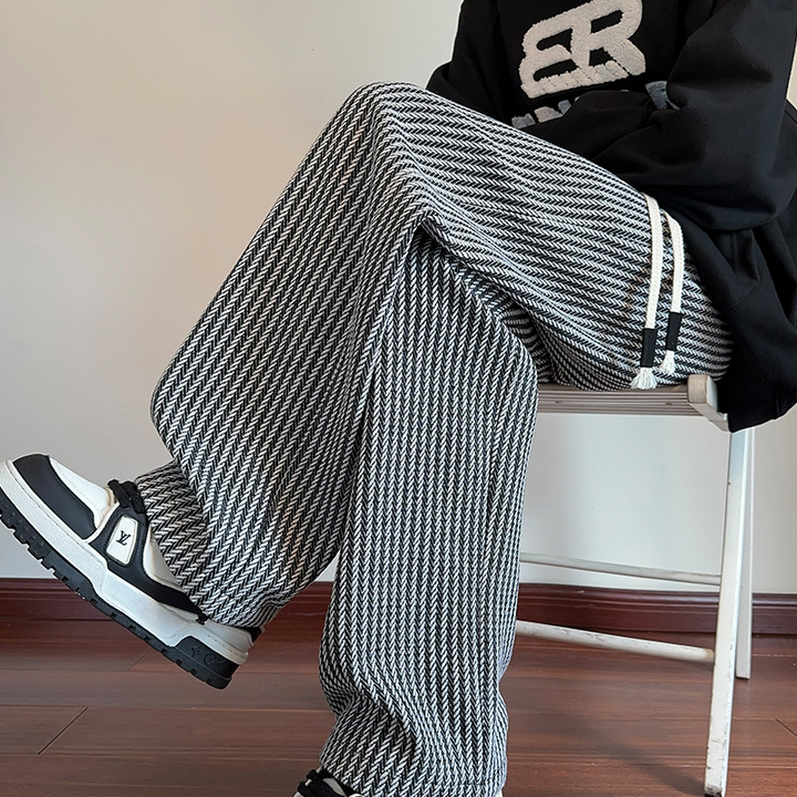 Relaxed fit unisex herringbone sweatpants, wide leg design for comfort & casual style.