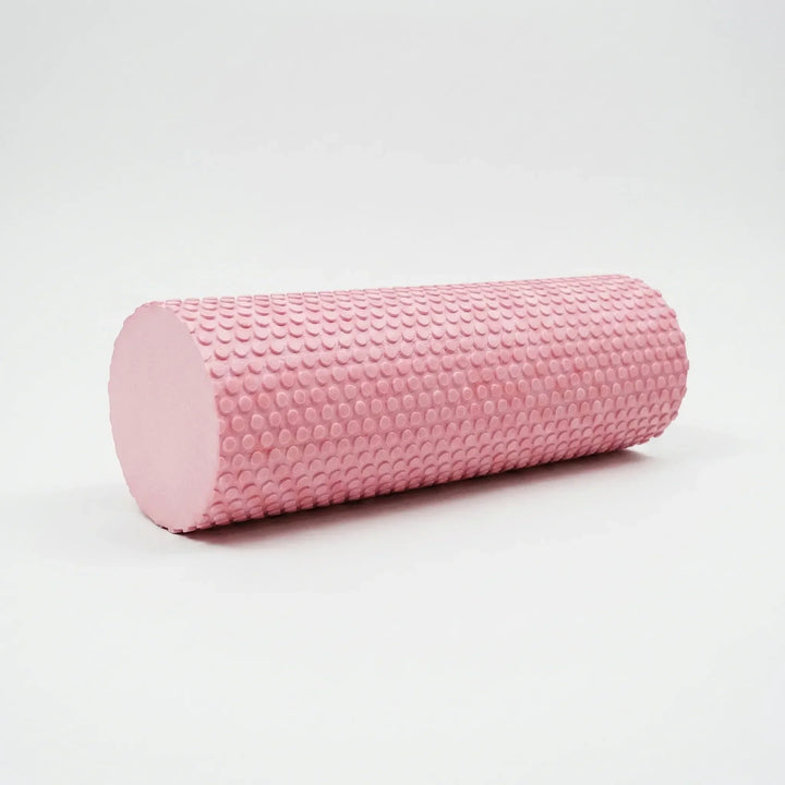 Person using high-density foam roller on back for muscle relief, deep tissue massage, and workout recovery.