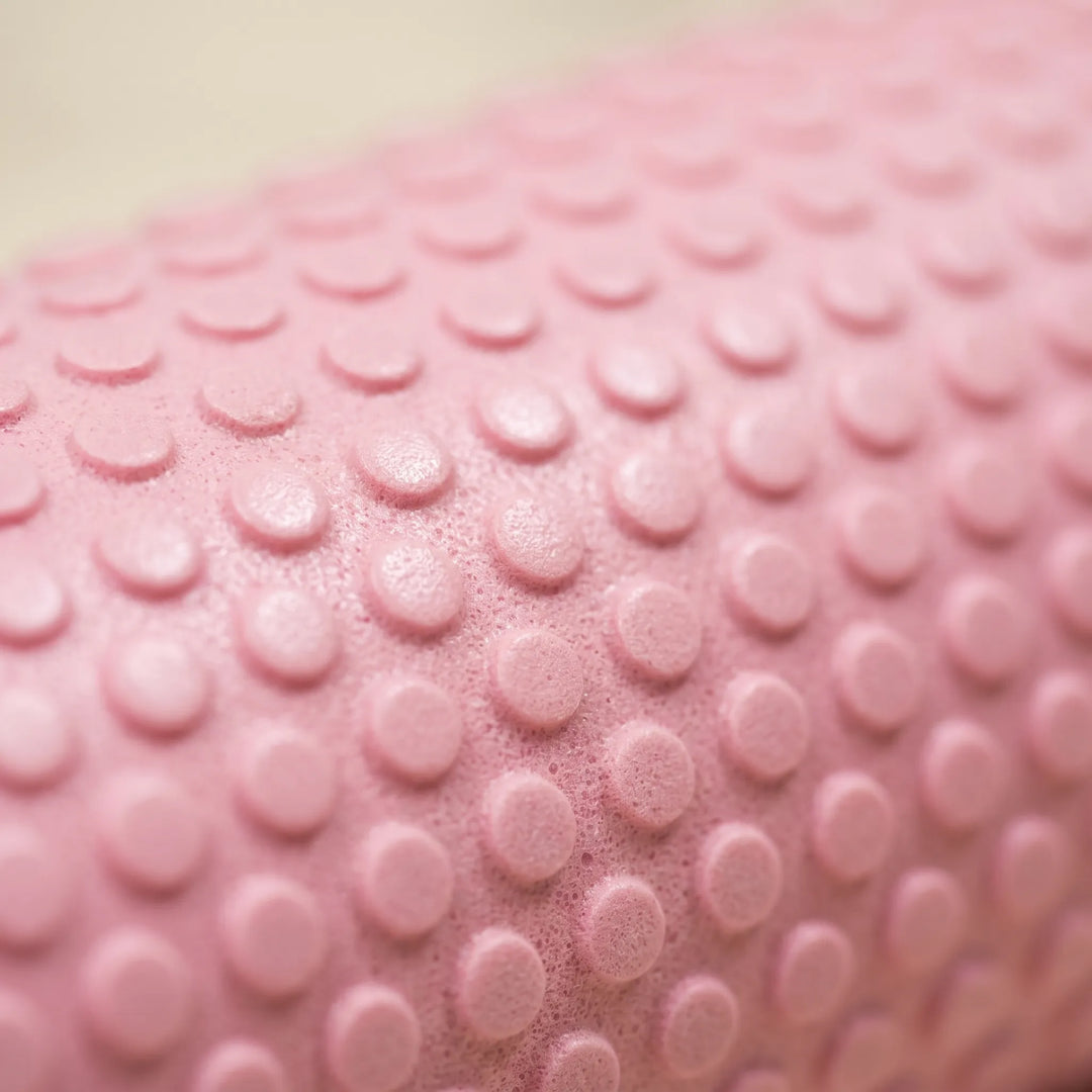 Unisex high-density foam roller for leg muscle relief, fitness, yoga, Pilates, and sports recovery.