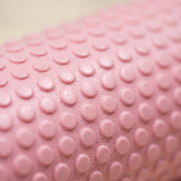Unisex high-density foam roller for leg muscle relief, fitness, yoga, Pilates, and sports recovery.