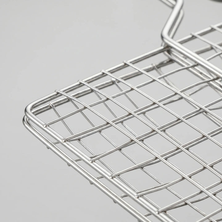 Durable hinged grill basket, perfect for outdoor cooking. Grilling tool for easy flipping of food on BBQ & campfires.