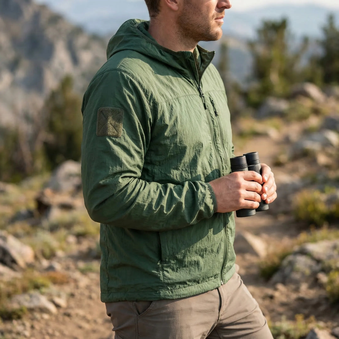 Unisex hooded lightweight tactical windbreaker jacket, water repellent & quick dry, perfect for outdoor hiking.