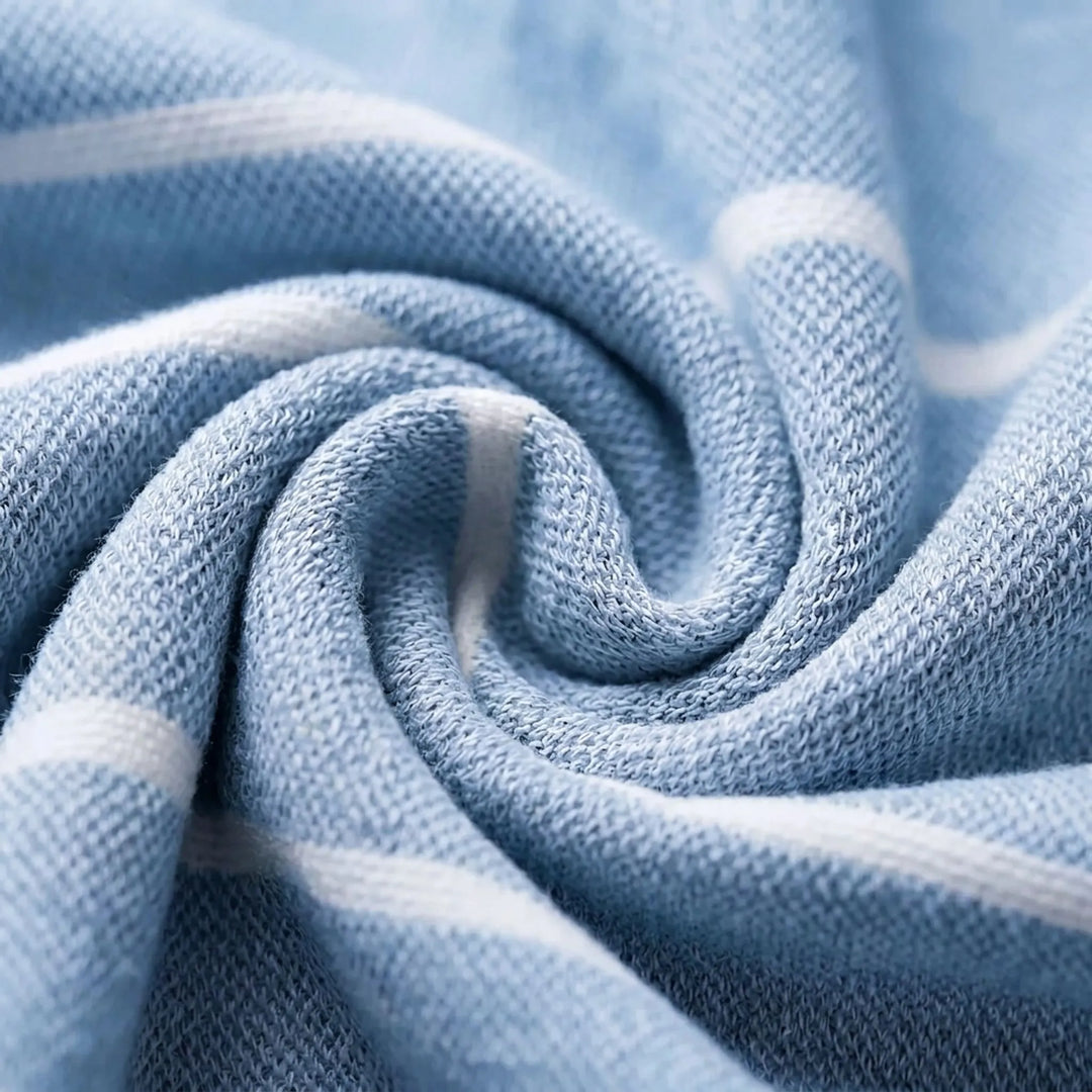 Highly absorbent, quick-dry hooded beach towel poncho. Ideal changing robe for swimmers, surfers & travelers.