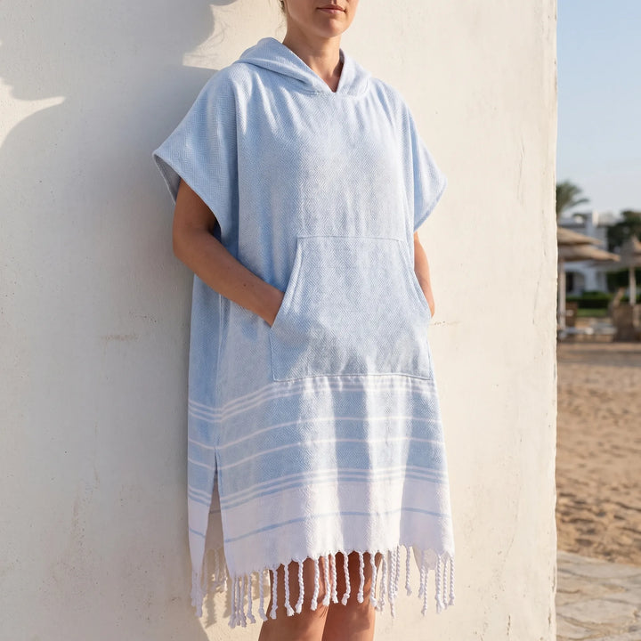 Unisex hooded towel poncho for easy beach changing & quick drying after swim.