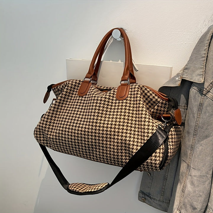 Spacious unisex houndstooth travel bag. Vegan leather weekender duffle, ideal carry-on for stylish trips.