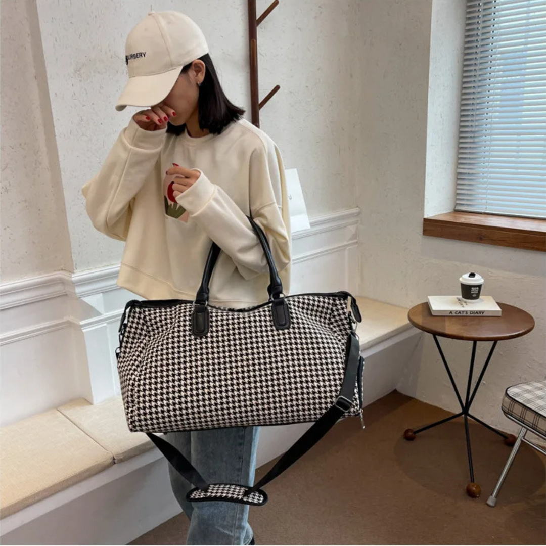 Houndstooth vegan leather travel duffle bag. Unisex carry-on weekender, durable and stylish for journeys.