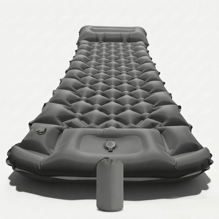 Compact inflatable camping mat with built-in pillow, essential outdoor gear for hikers and backpackers.