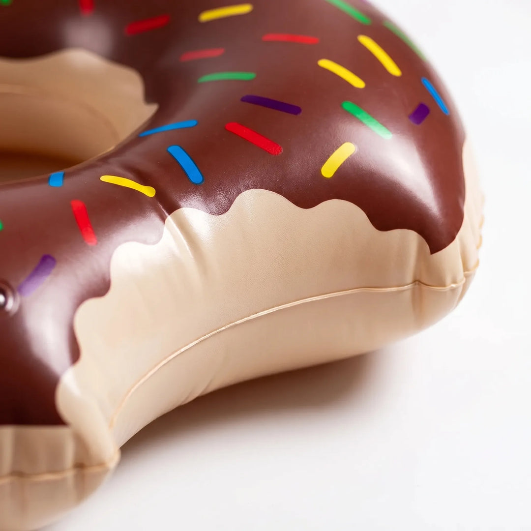 Unique inflatable donut pool float, a cute summer water toy and party accessory.
