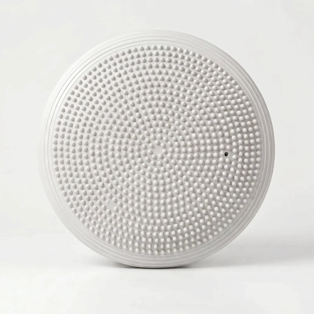 Round balance cushion for yoga, pilates & flexibility training. Essential fitness equipment & workout accessory.
