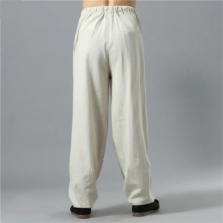Model walking in relaxed fit Kodama baggy pants, suitable for casual wear and active everyday fashion.