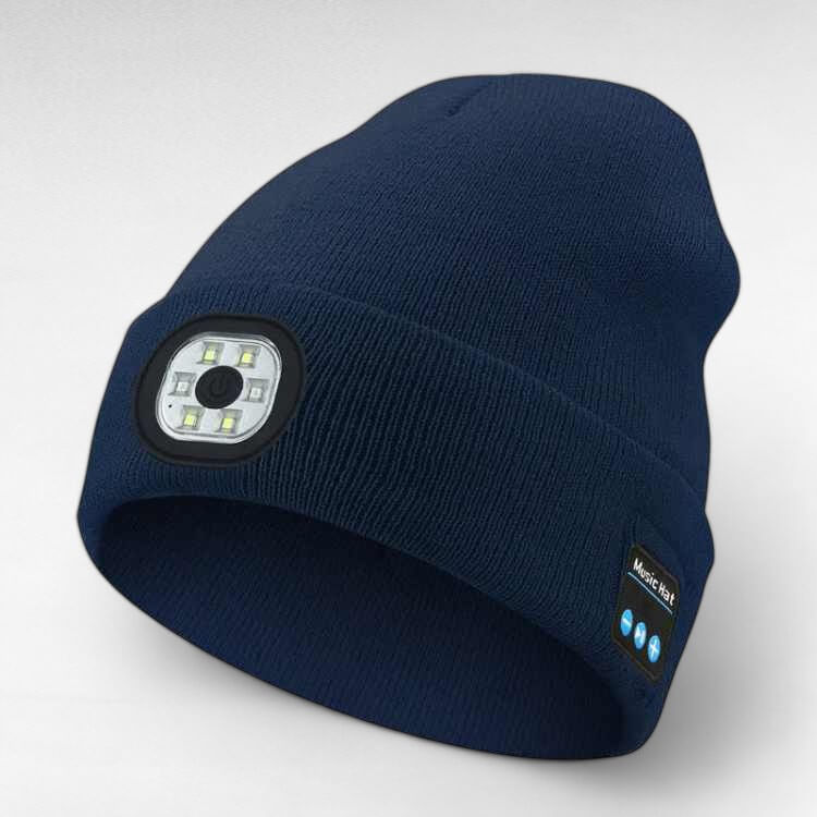 Person wearing a black unisex LED Bluetooth beanie outdoors, demonstrating hands-free music and visibility, running accessories.